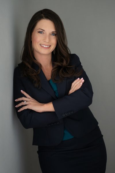 Suzanne Boy leaning against a wall